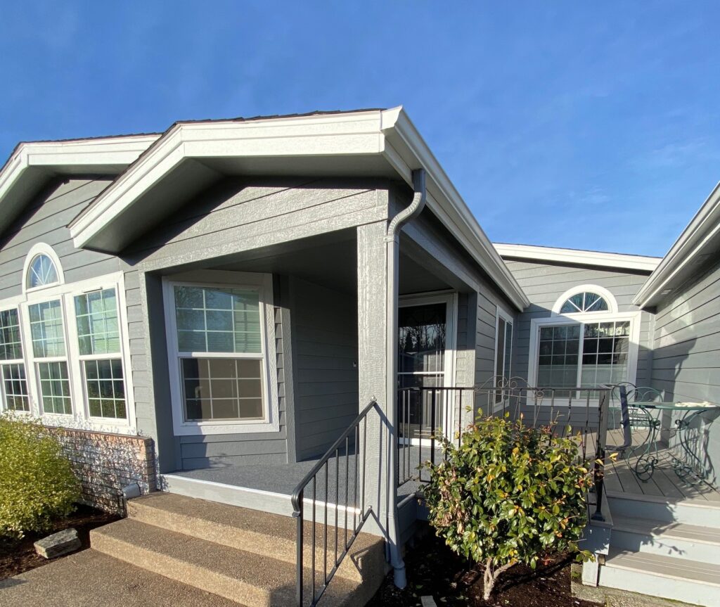Completed exterior painting project on a gray paint with white trim in Eugene, Oregon.