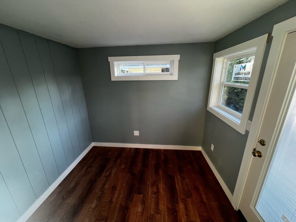 Sage for the walls and white paint for the trim in this bedroom Eugene, Oregon.