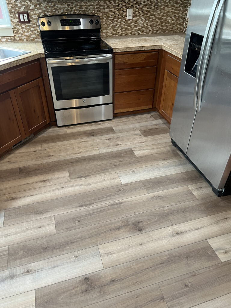 Luxury Vinyl Plank install in kitchen in Eugene, Oregon.