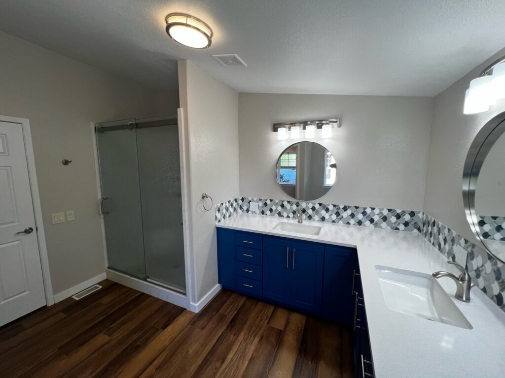New counters, blue cabinets, vanity, LED lighting, and walk in shower, Eugene, OR.